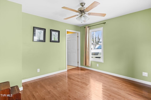 spare room featuring ceiling fan and light wood-type flooring