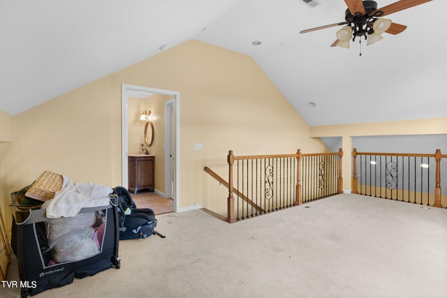 additional living space featuring vaulted ceiling, light colored carpet, and ceiling fan