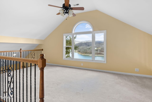 bonus room with ceiling fan, light colored carpet, and vaulted ceiling