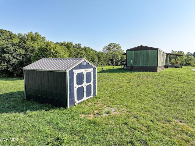 view of outbuilding with a yard