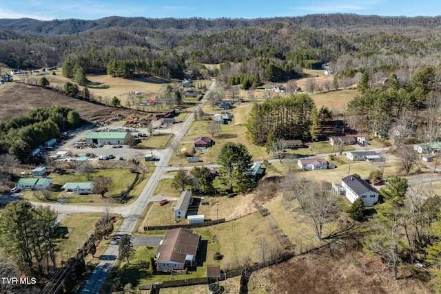 birds eye view of property with a wooded view