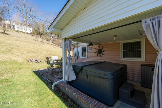 exterior space featuring a hot tub