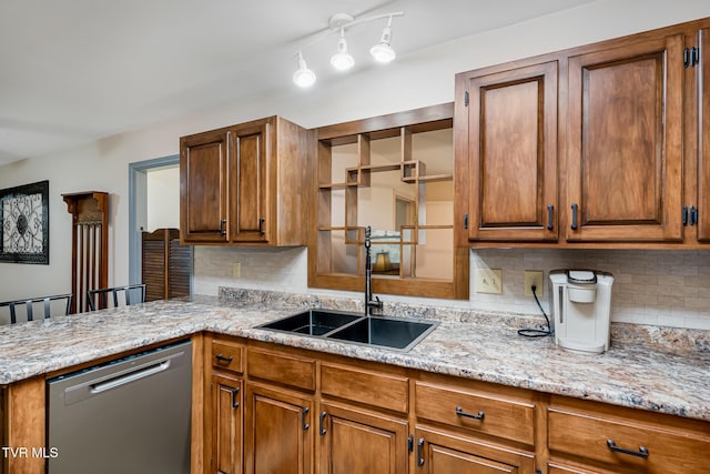 kitchen with a sink, backsplash, brown cabinets, and dishwasher