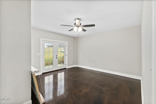 spare room featuring french doors and ceiling fan