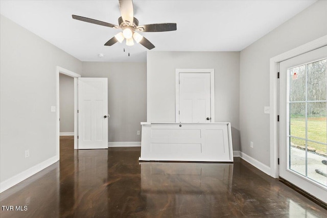 empty room with a healthy amount of sunlight and ceiling fan