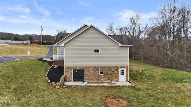 view of property exterior featuring a yard