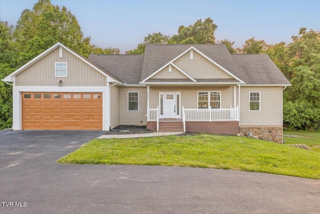 125 Forsyth Ln, Jonesborough, TN 37659 - view of front of property with a porch, a garage, asphalt driveway, a front yard, and a shingled roof