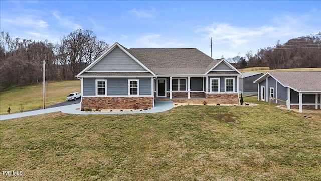 craftsman-style home with a front yard