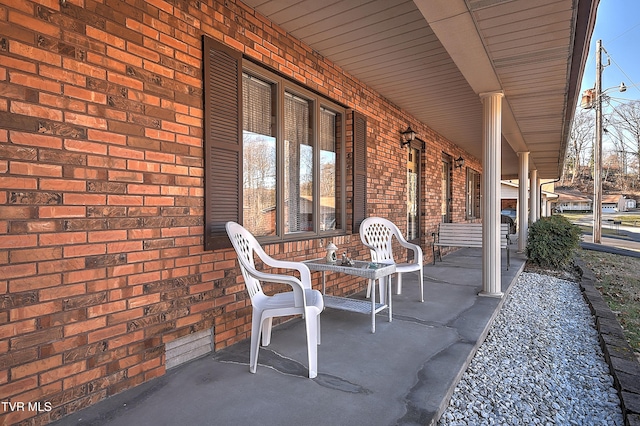 view of patio featuring a porch