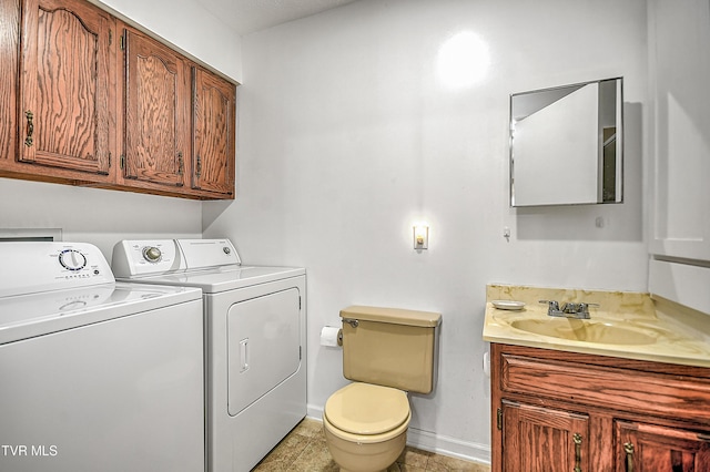 laundry room featuring separate washer and dryer and sink