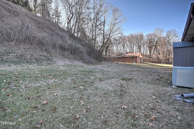 view of yard featuring central AC unit