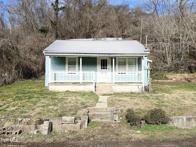 view of front of home with a front lawn and a porch