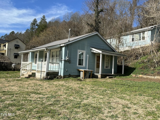 view of front of home with a front lawn and a porch