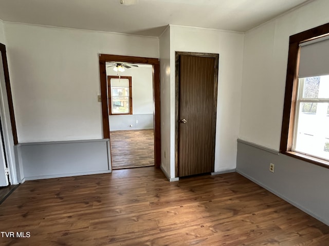 unfurnished bedroom featuring dark hardwood / wood-style floors