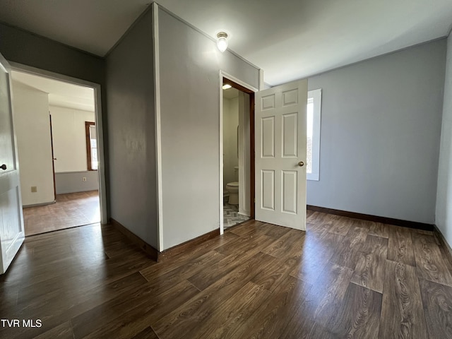 unfurnished bedroom featuring dark wood-type flooring