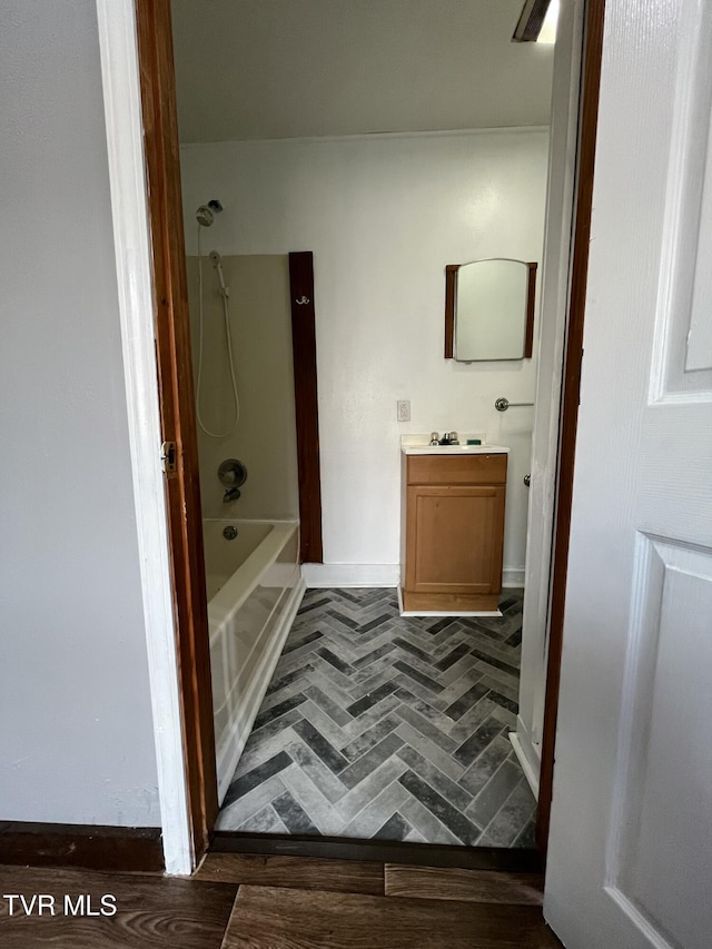 bathroom with vanity and  shower combination