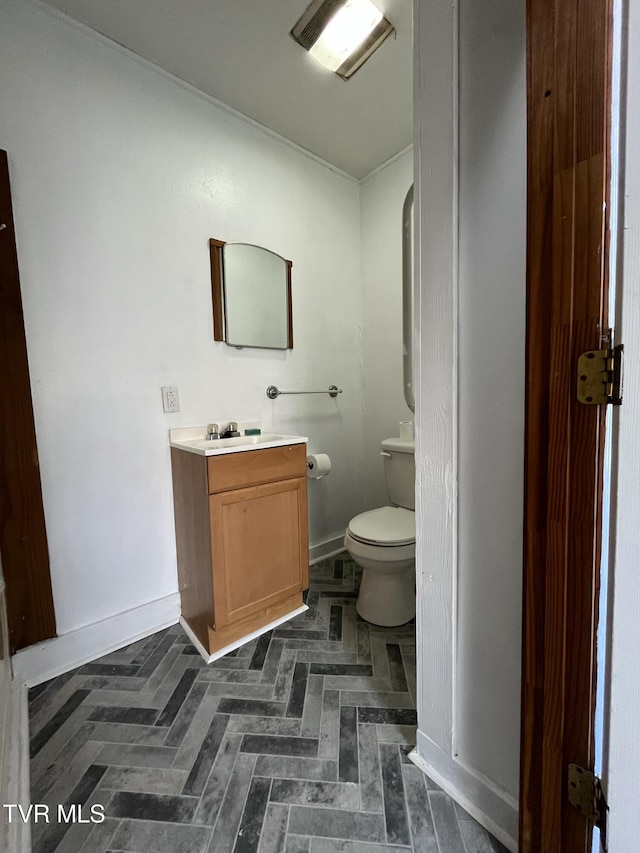 bathroom with vanity and toilet