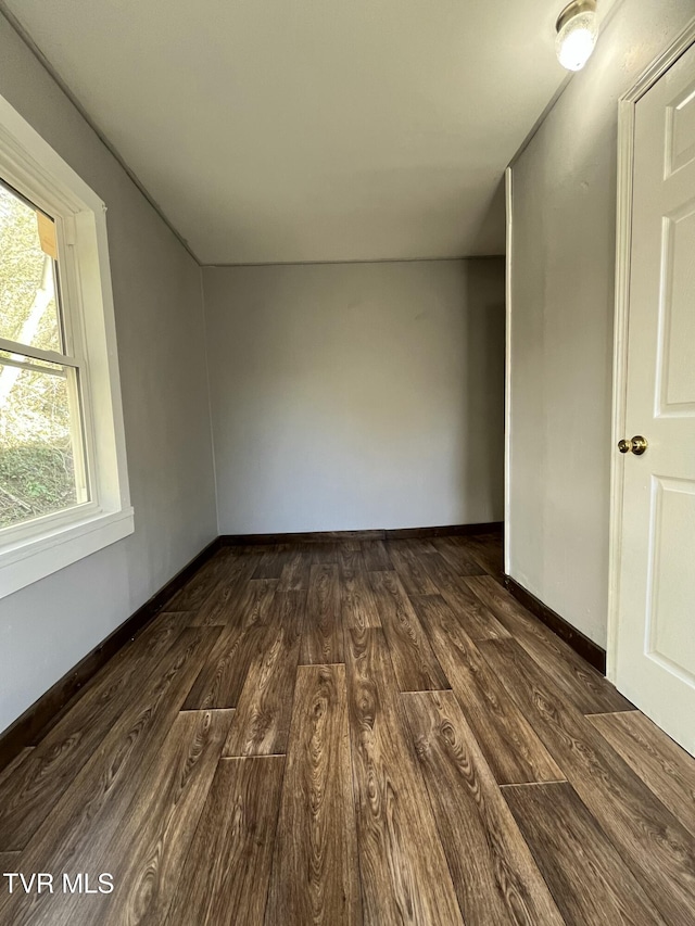 empty room with dark hardwood / wood-style floors