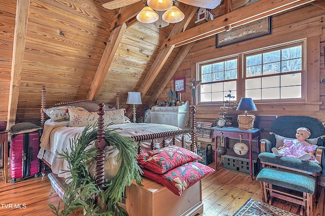 bedroom featuring wooden walls, lofted ceiling with beams, light hardwood / wood-style floors, and wooden ceiling