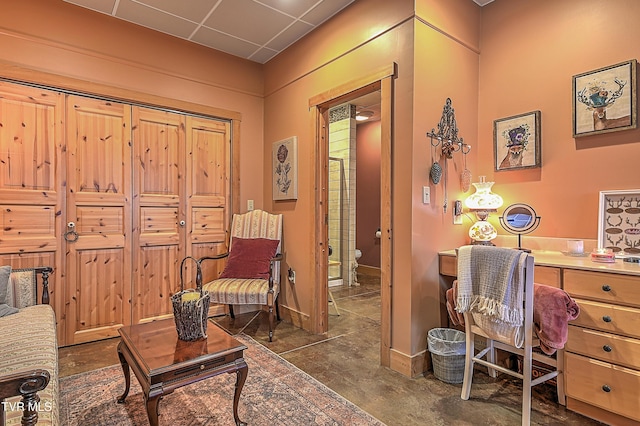 office area with a paneled ceiling