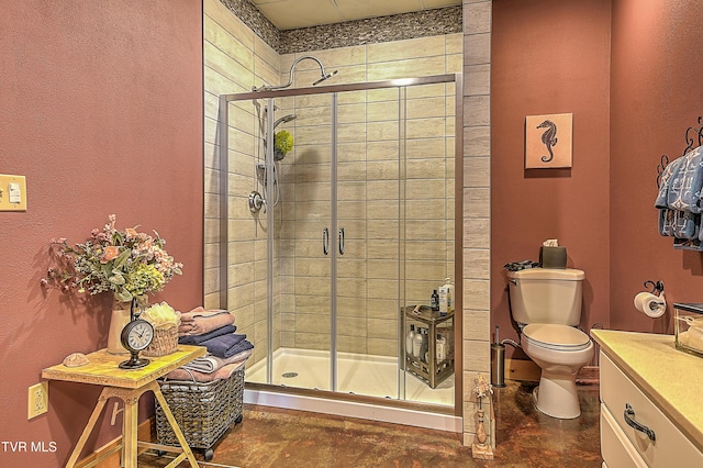 bathroom featuring an enclosed shower, vanity, concrete floors, and toilet