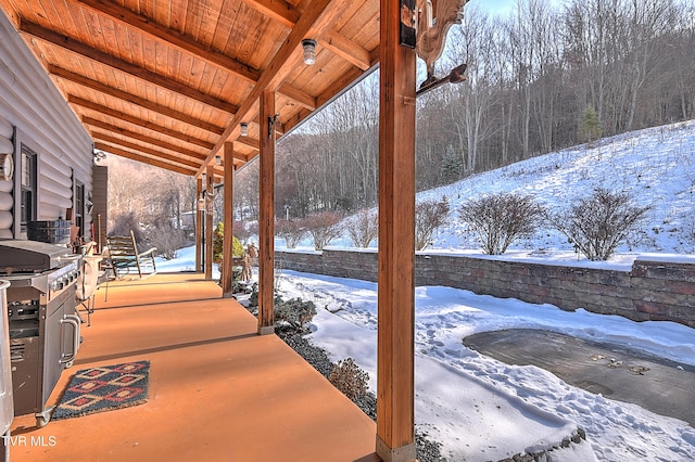 view of snow covered deck