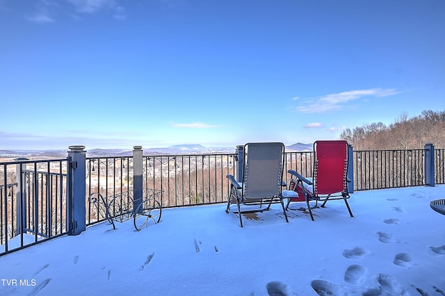 snow covered patio featuring a trampoline