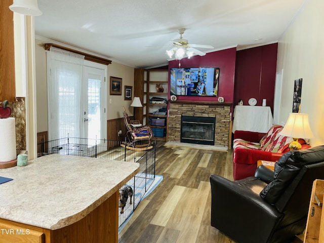 800 Buffalo Ridge Rd, Big Stone Gap, VA 24219 - living room with hardwood / wood-style flooring, ceiling fan, a fireplace, ornamental molding, and vaulted ceiling