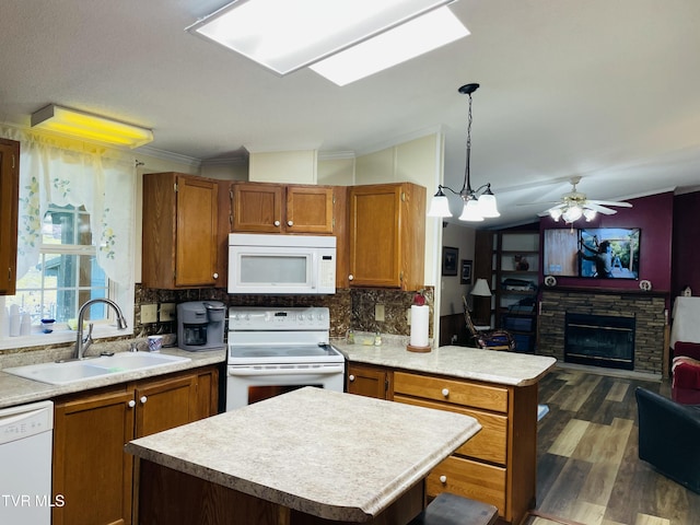 800 Buffalo Ridge Rd, Big Stone Gap, VA 24219 - kitchen featuring a kitchen island, a stone fireplace, pendant lighting, sink, and white appliances