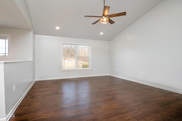 empty room featuring ceiling fan, dark hardwood / wood-style floors, and vaulted ceiling
