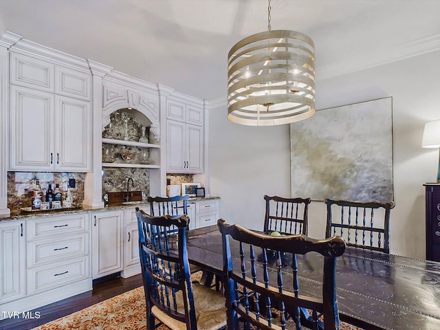 400 Bancroft Chapel Rd, Kingsport, TN 37660 - dining space with wet bar, dark wood-type flooring, and crown molding