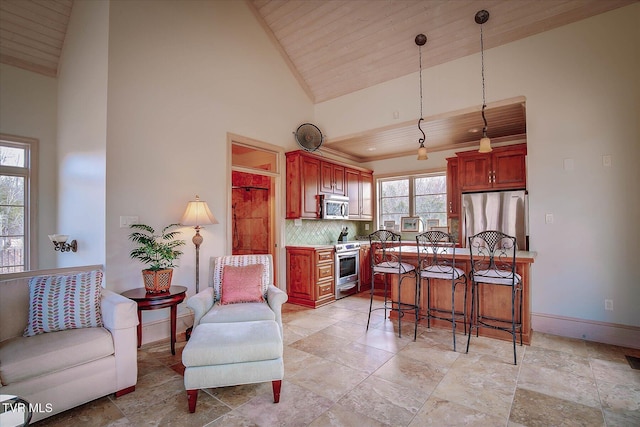 400 Bancroft Chapel Rd, Kingsport, TN 37660 - kitchen featuring stainless steel appliances, wood ceiling, tasteful backsplash, decorative light fixtures, and a breakfast bar
