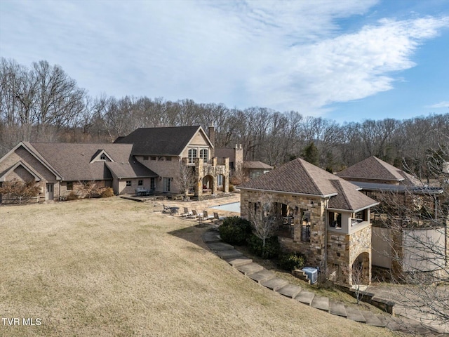 400 Bancroft Chapel Rd, Kingsport, TN 37660 - view of front of home featuring stone siding, a chimney, and a front lawn