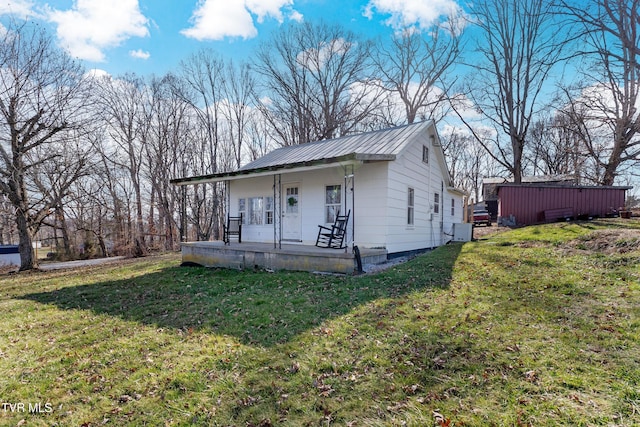 view of front of home with a porch and a front lawn