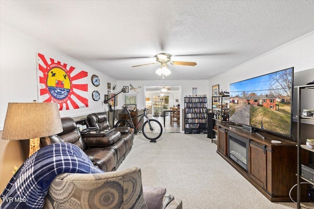 living room with ceiling fan and a textured ceiling