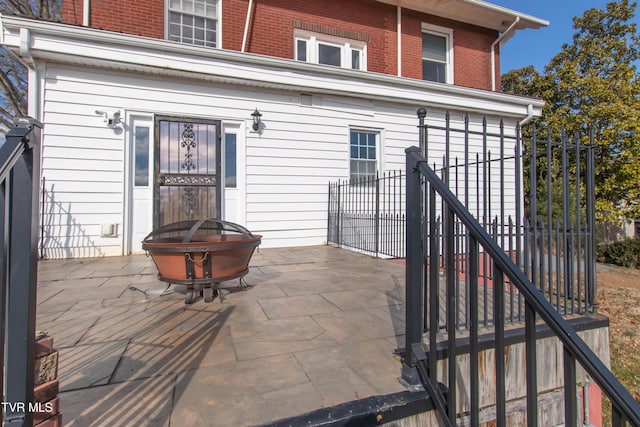 view of patio / terrace featuring an outdoor fire pit