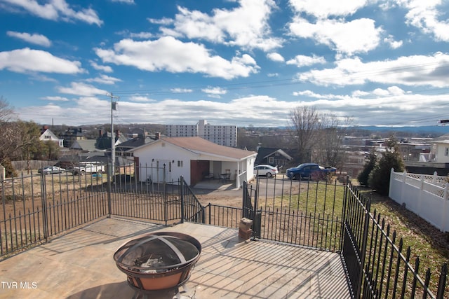 view of patio / terrace with a fire pit