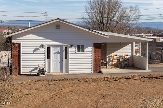 rear view of property with a patio area