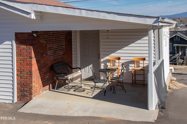 view of patio / terrace with a mountain view