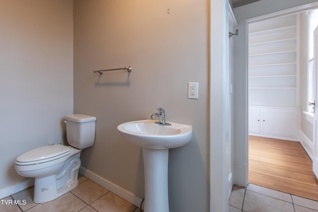 bathroom featuring tile patterned flooring, sink, and toilet