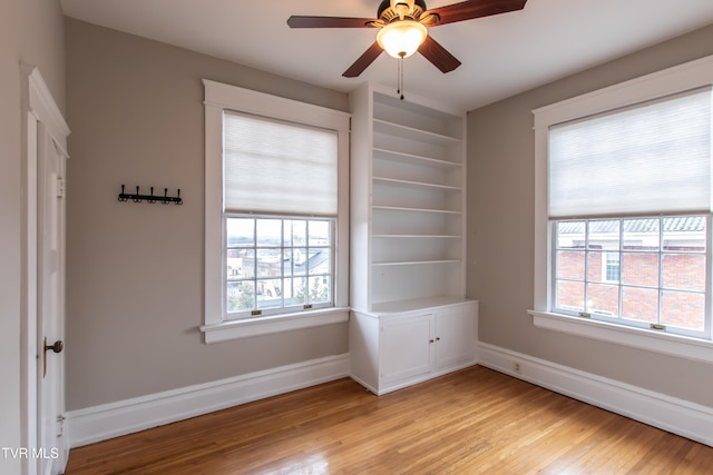 spare room featuring ceiling fan and light wood-type flooring