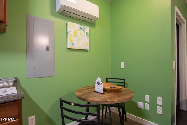 dining area with a wall mounted air conditioner and electric panel