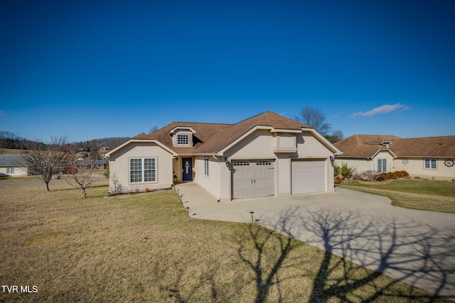 view of front of home featuring a garage and a front yard