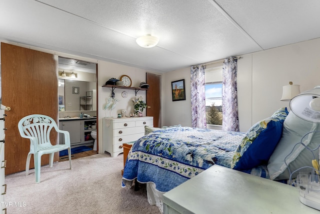 bedroom featuring carpet flooring and a textured ceiling