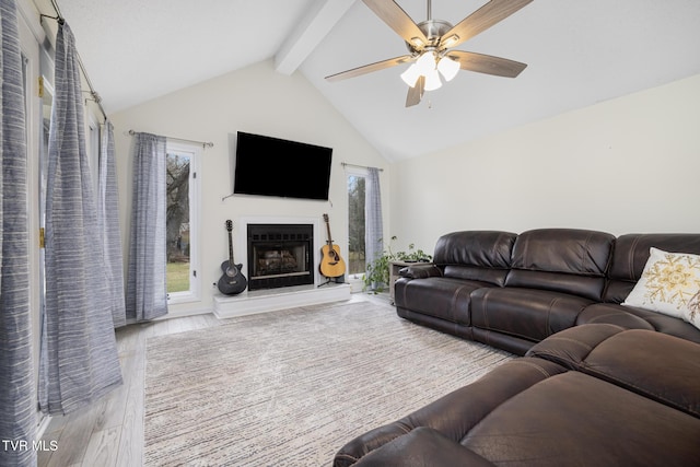 living room featuring beamed ceiling, ceiling fan, high vaulted ceiling, and light wood-type flooring