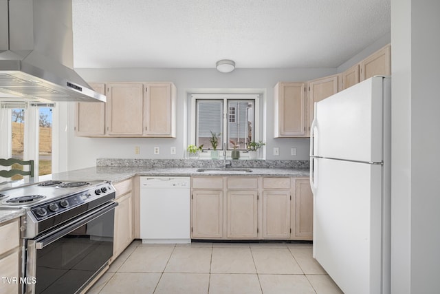 kitchen featuring light brown cabinetry, sink, white appliances, and island range hood