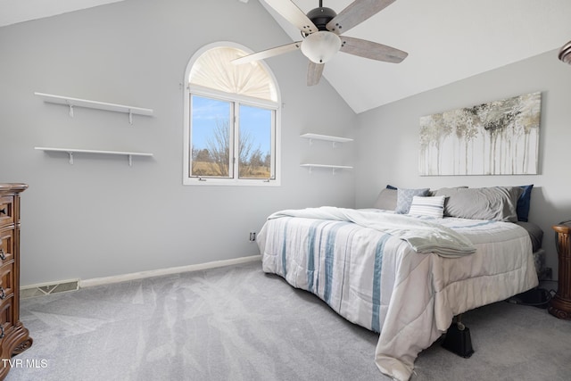 carpeted bedroom featuring lofted ceiling and ceiling fan