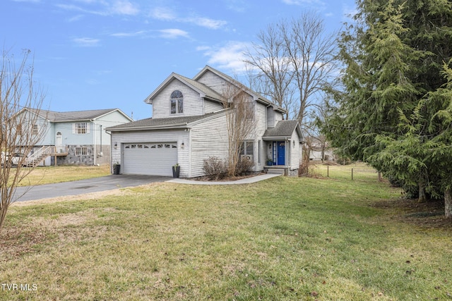 view of front facade featuring a garage and a front lawn