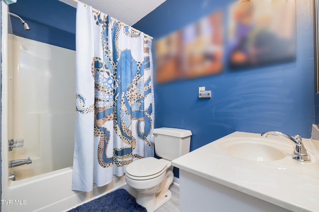 full bathroom featuring shower / bath combination with curtain, vanity, toilet, and a textured ceiling