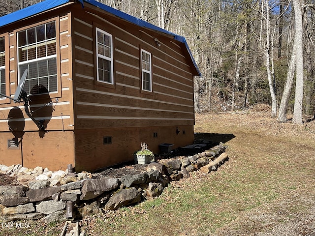 view of property exterior with crawl space